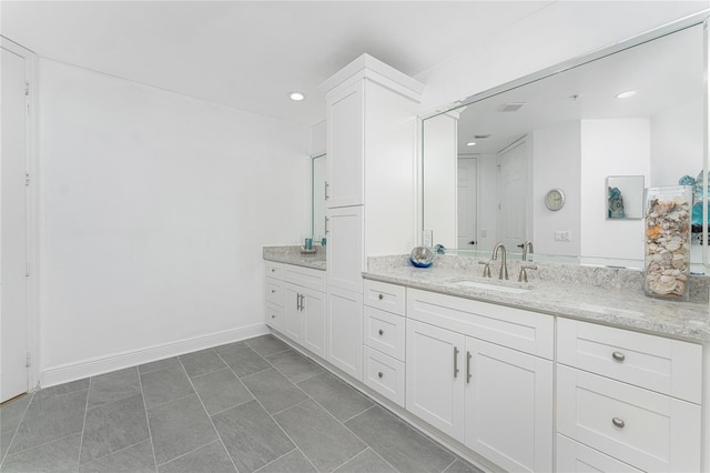 bathroom featuring tile patterned floors and vanity