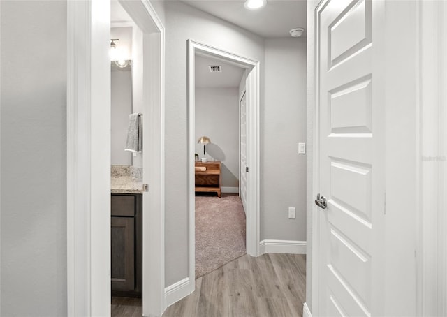 hall featuring light wood-type flooring