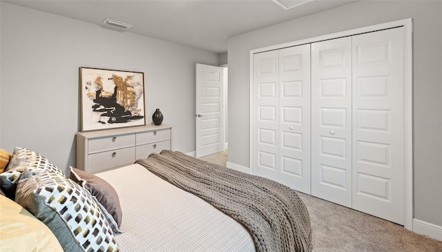 carpeted bedroom with a closet