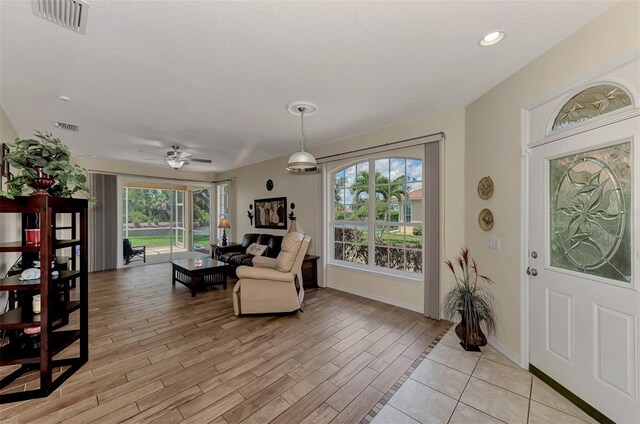 interior space featuring ceiling fan