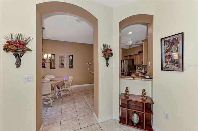 hallway with light tile patterned floors