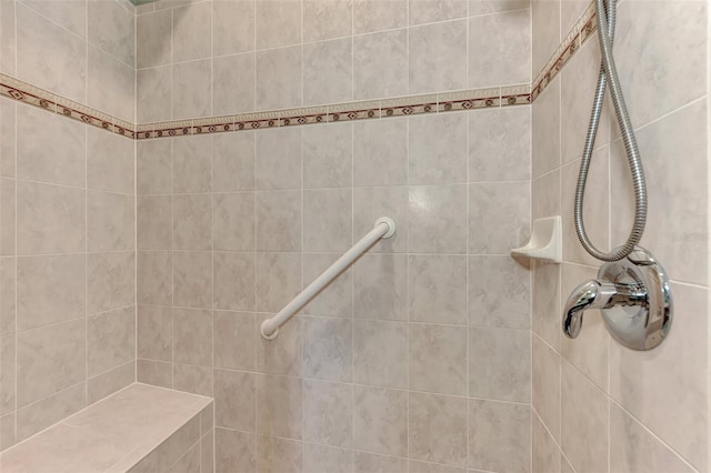 bathroom with tiled shower