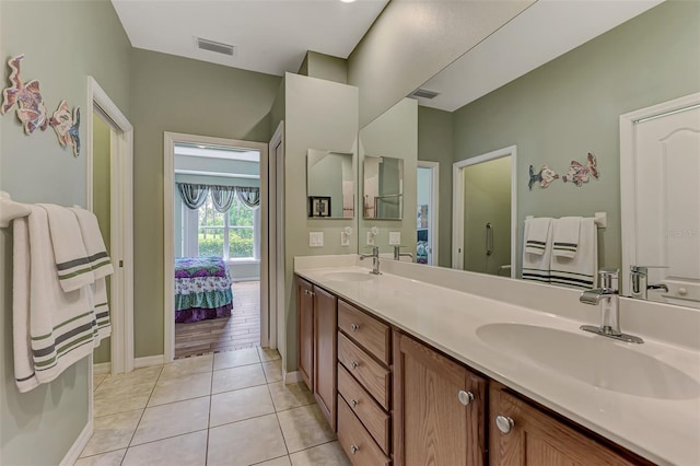 bathroom featuring tile patterned floors and vanity