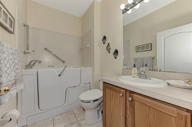 bathroom with vanity, a bath, tile patterned floors, and toilet