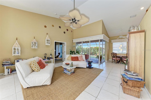 tiled living room with high vaulted ceiling and ceiling fan