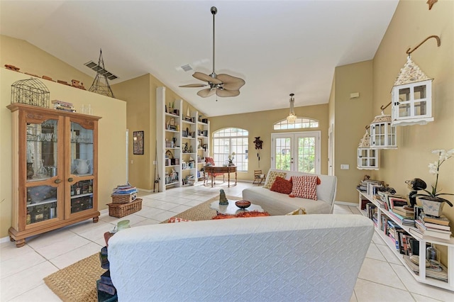 bedroom with light tile patterned floors, vaulted ceiling, and french doors