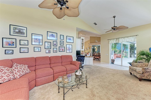 carpeted living room featuring high vaulted ceiling and ceiling fan