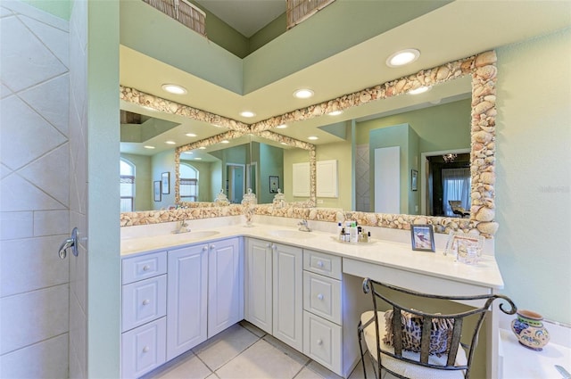 bathroom with tile patterned flooring and vanity