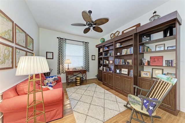 sitting room featuring ceiling fan and light hardwood / wood-style floors