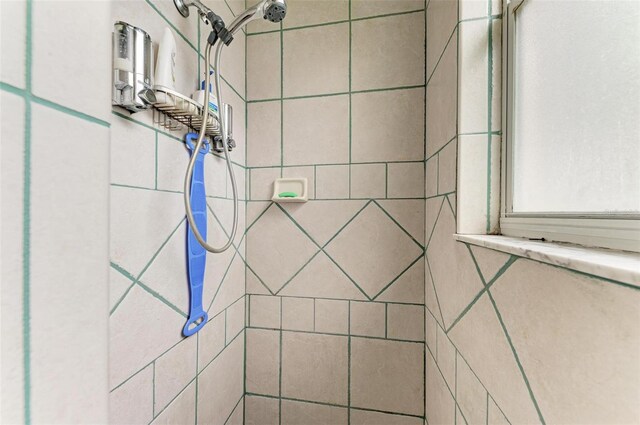 interior space featuring tiled shower