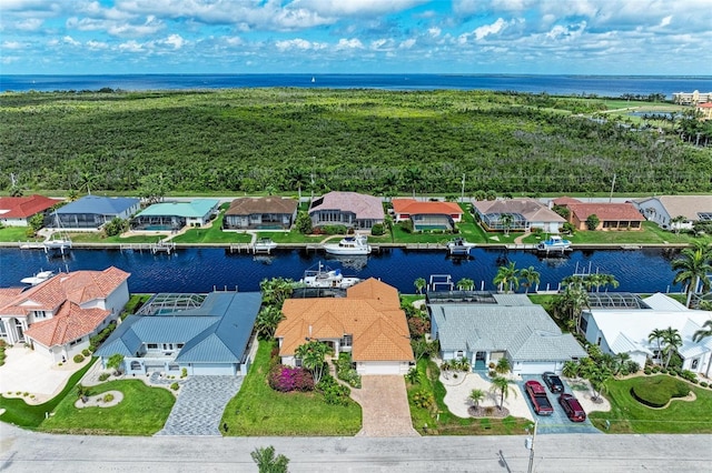 birds eye view of property featuring a water view