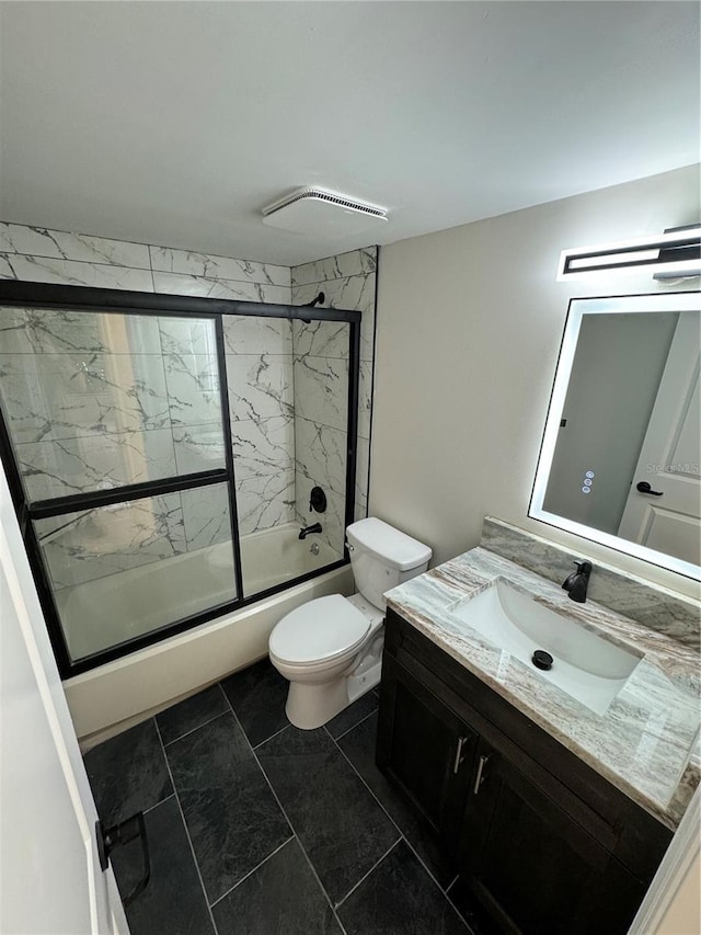 full bathroom with vanity, toilet, and combined bath / shower with glass door