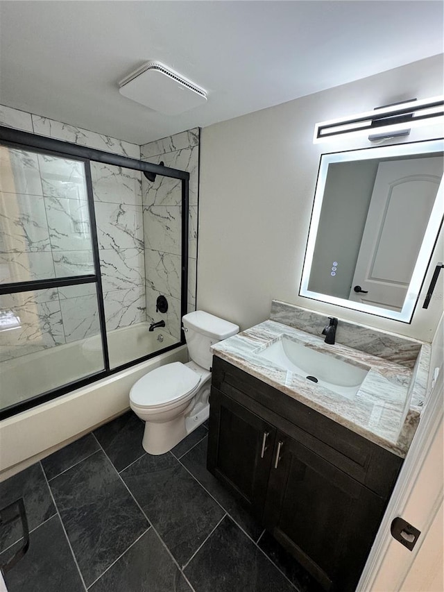 full bathroom featuring tile patterned flooring, toilet, vanity, and combined bath / shower with glass door