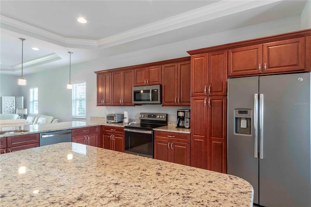 kitchen featuring light stone countertops, a raised ceiling, crown molding, decorative light fixtures, and appliances with stainless steel finishes