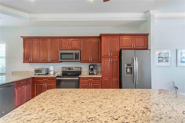 kitchen featuring stainless steel appliances, light stone counters, and ornamental molding