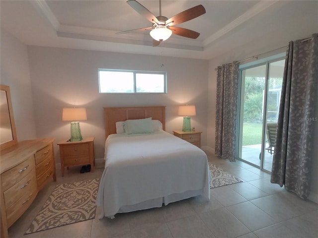 bedroom featuring a tray ceiling, ceiling fan, light tile patterned flooring, and access to outside