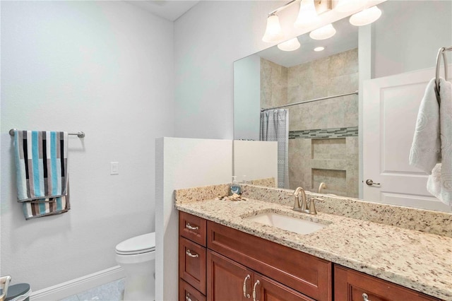 bathroom with tile patterned flooring, vanity, toilet, and curtained shower