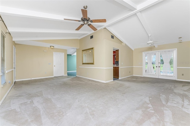 unfurnished living room with vaulted ceiling with beams, ceiling fan, french doors, and light colored carpet