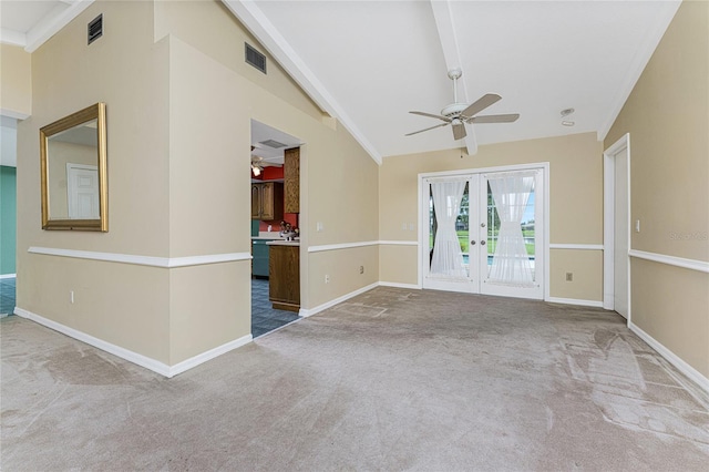 spare room with french doors, light colored carpet, ceiling fan, and ornamental molding