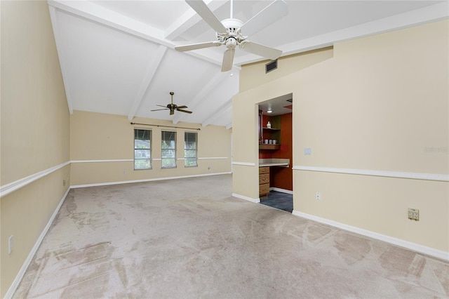 unfurnished room featuring carpet, lofted ceiling with beams, and ceiling fan