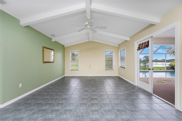 tiled empty room featuring ceiling fan and lofted ceiling with beams