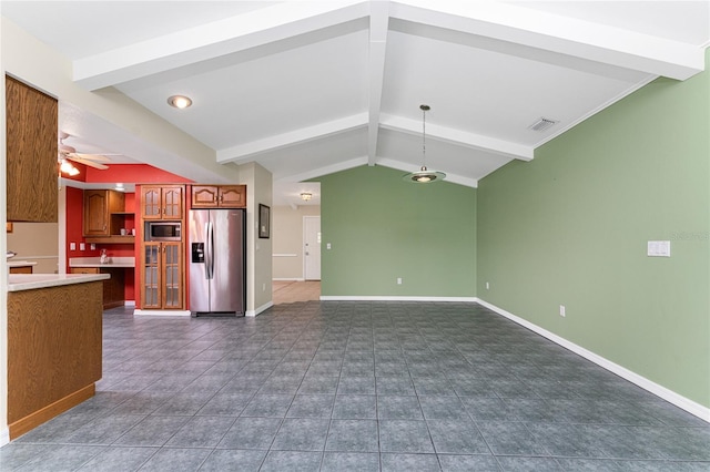 kitchen with vaulted ceiling with beams, ceiling fan, stainless steel appliances, and decorative light fixtures