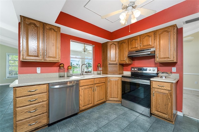 kitchen featuring appliances with stainless steel finishes, ceiling fan, a wealth of natural light, and sink