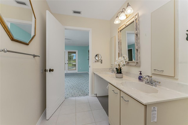 bathroom featuring tile patterned flooring and vanity