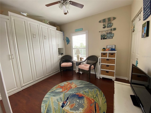 interior space featuring dark hardwood / wood-style flooring and ceiling fan