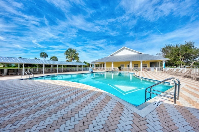 view of swimming pool with a patio area