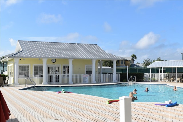 view of swimming pool with a patio