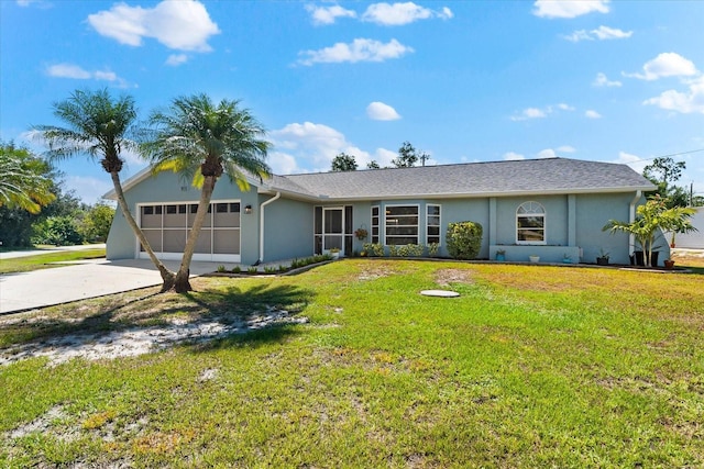 ranch-style house featuring a front lawn and a garage