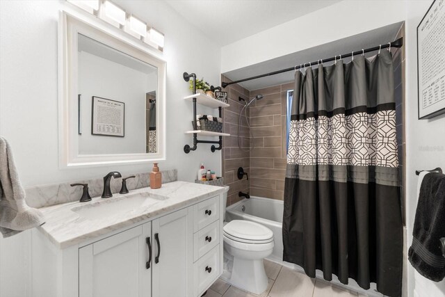 full bathroom with tile patterned floors, shower / tub combo with curtain, vanity, and toilet