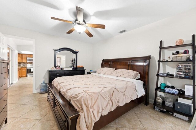 bedroom featuring ceiling fan and light tile patterned flooring