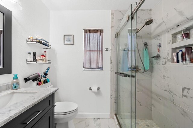 bathroom featuring vanity, toilet, and walk in shower