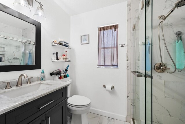 bathroom with vanity, toilet, and walk in shower