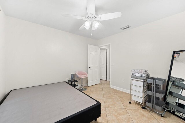 bedroom featuring ceiling fan and light tile patterned flooring