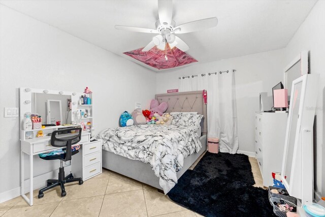 tiled bedroom with ceiling fan