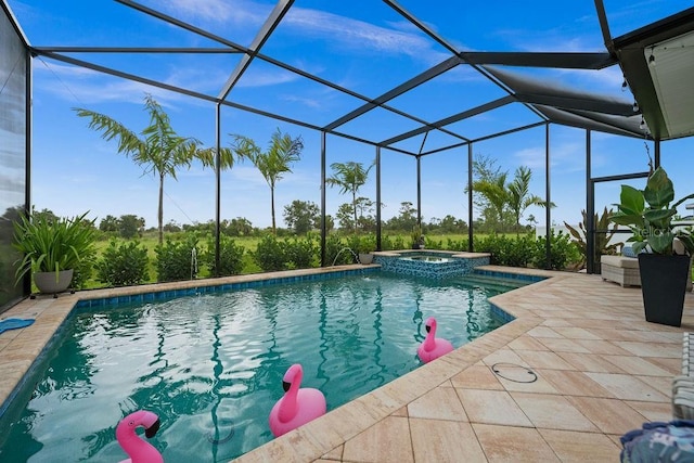 view of pool with a lanai, a patio area, and an in ground hot tub