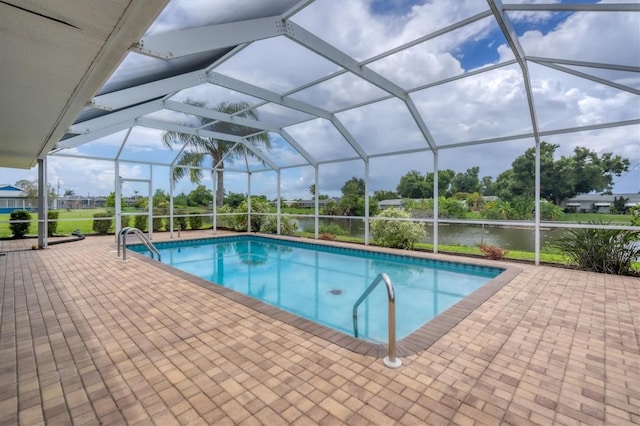 view of swimming pool with a patio and glass enclosure