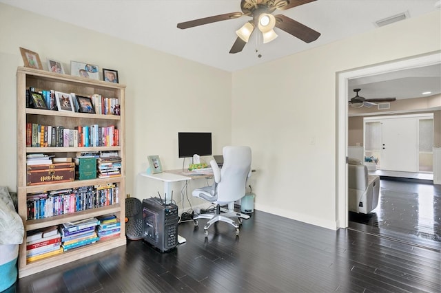 office space with dark wood-type flooring