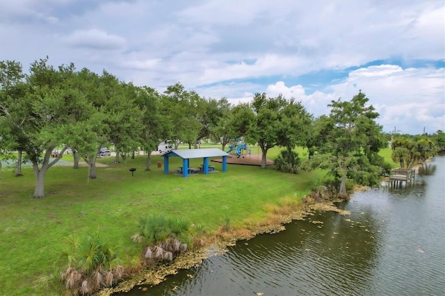 exterior space featuring a water view and a lawn