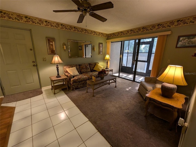 tiled living room featuring ceiling fan