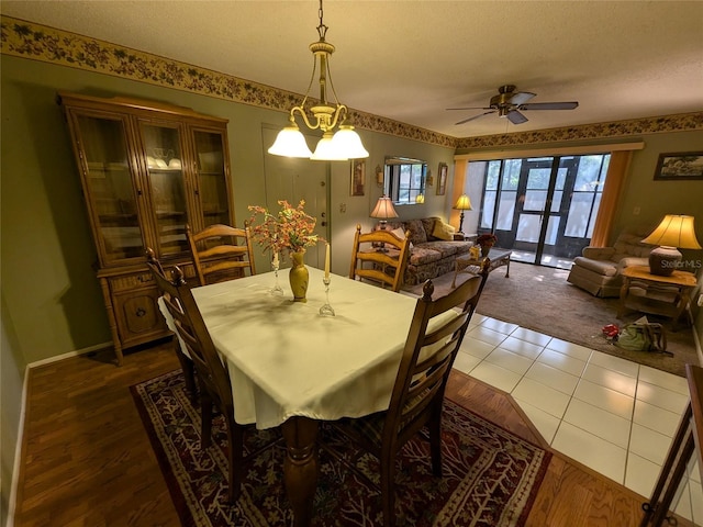 dining room with ceiling fan, french doors, and a textured ceiling