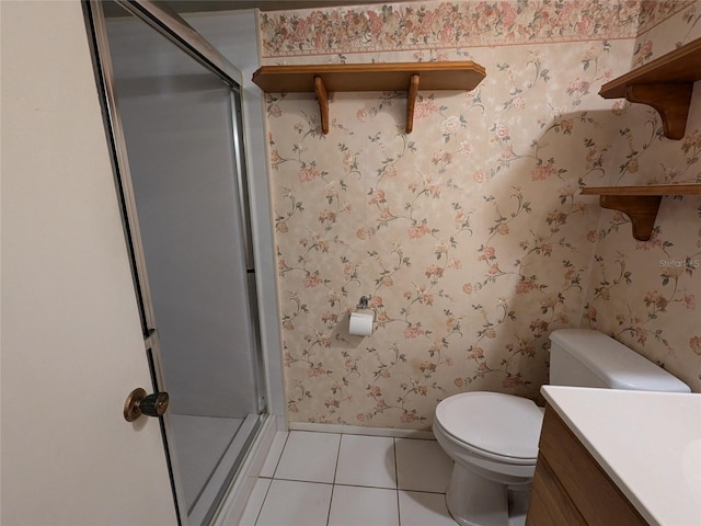 bathroom featuring vanity, an enclosed shower, tile patterned floors, and toilet