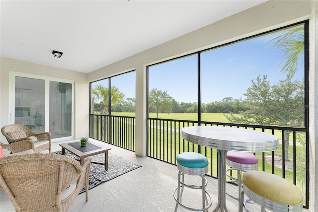 sunroom / solarium featuring a healthy amount of sunlight