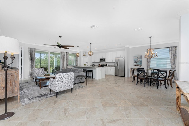 tiled living room featuring sink, ceiling fan with notable chandelier, and ornamental molding