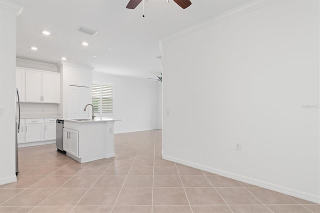 kitchen with ceiling fan, light tile patterned floors, an island with sink, and white cabinets