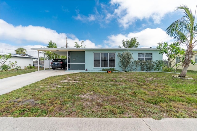 22062 Marshall Ave, Port Charlotte, FL 33952 - view of front of property featuring driveway, a front yard, stucco siding, and an attached carport