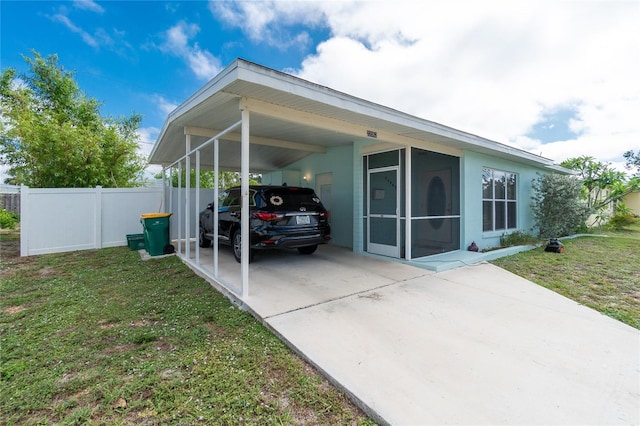 22062 Marshall Ave, Port Charlotte, FL 33952 - view of property exterior featuring concrete driveway, an attached carport, and stucco siding